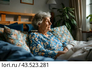 Пожилая женщина одна в спальне. Стоковое AI-изображение, AI-художник Щеголева Ольга / Фотобанк Лори