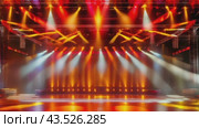 The stage is brightly lit with numerous lights, yet appears devoid of performers. Стоковое AI-видео, аниматор Юрий Поздников / Фотобанк Лори