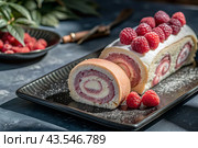 Swiss sponge roll with raspberries, a delicious fruit and cream dessert filled with cream cheese, decorated with fresh raspberries. Стоковое AI-изображение, AI-художник Photojuli / Фотобанк Лори