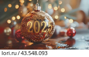 Christmas greeting card with golden Christmas tree ball and text 2025, garland lights and Christmas tree on festive background. Slow motion footage. Happy New Year holidays. Стоковое AI-видео, аниматор Ирина Михайличенко / Фотобанк Лори