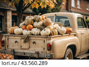 Autumn, autumn design. A large harvest of pumpkins on the back seat of a retro pickup truck, close-up. Стоковое AI-изображение, AI-художник Photojuli / Фотобанк Лори