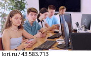 Student are engrossed in their mobile phones, working diligently on their tasks. Стоковое видео, видеограф Яков Филимонов / Фотобанк Лори