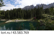 Beautiful lake and mountain view in Dolomites, Lago di Carezza, Italy. Стоковое видео, видеограф Яков Филимонов / Фотобанк Лори