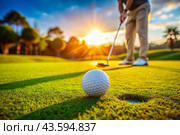 The banner. A white ball and a metal golf club are lying on the lawn in the hands of a man against the sunset background. An advertisement for a golf game at a country club. Free space for text. Стоковое AI-изображение, AI-художник Photojuli / Фотобанк Лори