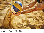 A poignant moment in the game. A volleyball falls on the sand. A volleyball player tries to hit the ball. Concepts of summer Olympic sports. Стоковое AI-изображение, AI-художник Photojuli / Фотобанк Лори