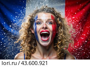 A beautiful athlete or cheerleader from France with joyful shouts after winning the competition at the Olympic Games against the background of the French flag. Стоковое AI-изображение, AI-художник Photojuli / Фотобанк Лори