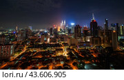 Nighttime timelapse of the Malaysian capital Kuala Lumpur. Стоковое видео, видеограф Mikhail Davidovich / Фотобанк Лори