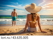 Мужчина и женщина загорают на песчаном пляже у моря. A man and a woman sunbathe on a sandy beach by the sea. Стоковое AI-изображение, AI-художник Гер Олег / Фотобанк Лори