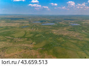 Arctic tundra in summer from an altitude of 2000 meters. Cloudy sky. Variety of colors and landscapes. The vastness of pristine nature. Shadow from the clouds. Стоковое фото, фотограф Владимир Ендовицкий / Фотобанк Лори