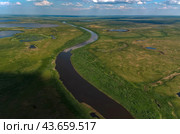 Arctic tundra in summer from an altitude of 2000 meters. Cloudy sky. Variety of colors and landscapes. The vastness of pristine nature. Shadow from the clouds. Стоковое фото, фотограф Владимир Ендовицкий / Фотобанк Лори