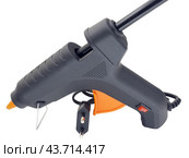 Клеевой пистолет на белом фоне. Electric hot glue gun isolated on white background. Стоковое фото, фотограф Татьяна Д / Фотобанк Лори