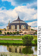 Tula, Russia - July 23, 2024: Panoramic view of the Upa River embankment and the Tula State Arms Museum in Tula, Russia. Reflection of the museum in the Upa River. Редакционное фото, фотограф Оксана Медведева / Фотобанк Лори
