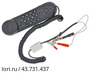Телефонная трубка с зажимами на белом фоне. Telephone handset with clips on white background. Стоковое фото, фотограф Татьяна Д / Фотобанк Лори