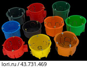 Разноцветные пластиковые электрические подразетники. Plastic electrical junction box. Стоковое фото, фотограф Татьяна Д / Фотобанк Лори