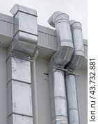 Вентиляционная труба или воздуховод. Large industrial shiny metal pipes on white background. Стоковое фото, фотограф Татьяна Д / Фотобанк Лори