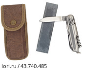 Точильный камень и нож на белом фоне. Sharpener stone and knife isolated on white background. Стоковое фото, фотограф Татьяна Д / Фотобанк Лори