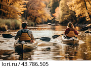 Tourism and sports. Kayakers with oars in their hands are rafting on the river against the background of the autumn landscape. Стоковое AI-изображение, AI-художник Photojuli / Фотобанк Лори