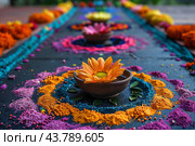Colorful Rangoli Design Displayed With Flowers and Decorative Items for Festival Celebration. Стоковое AI-изображение, AI-художник Сергей Толмачёв / Фотобанк Лори