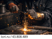 Work at the factory. Working professions. Men's hands in protective gloves with metal. There are sparks around. Hard work that requires high concentration and professionalism. Стоковое AI-изображение, AI-художник Photojuli / Фотобанк Лори