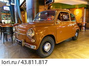 Old Fiat-600 car in the interior of the Kandinsky restaurant. City of Tangier. Morocco (2024 год). Редакционное фото, фотограф Евгений Ткачёв / Фотобанк Лори