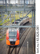 Train of the Moscow central railway circle called Lastochka (Swallow in English) goes along the route (2024 год). Редакционное фото, фотограф Константин Григорьев / Фотобанк Лори