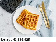 Chaffle, ketogenic diet health food. Homemade keto waffles with egg, mozzarella cheese. Gluten - free and carb-free. White background. Стоковое фото, фотограф Natalia Gdovskaia / Фотобанк Лори