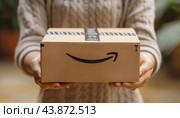 Woman holding a just delivered amazon package. Стоковое AI-изображение, AI-художник Юрий Поздников / Фотобанк Лори