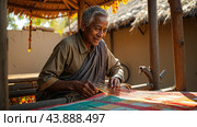 Traditional Indian weaver crafting on handloom in village settingries. Стоковое AI-изображение, AI-художник Анна Маркина / Фотобанк Лори