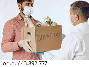 Donation box of food for people suffering from coronavirus pandemia. Стоковое фото, фотограф Сергей Толмачёв / Фотобанк Лори
