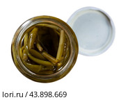 Open glass jar with pickled ramsons scapes on table. Стоковое фото, фотограф Яков Филимонов / Фотобанк Лори