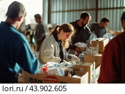 Community Volunteers Organizing Donations at Local Charity Warehouse During Daytime. Стоковое AI-изображение, AI-художник Сергей Толмачёв / Фотобанк Лори