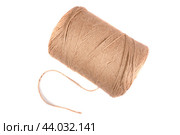 A large skein of strong, harsh threads for filing documents lies at an angle on a white background in isolation. View from above. Стоковое фото, фотограф Ярославский Максим / Фотобанк Лори