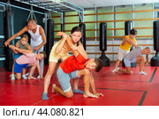 Young boys and girls on self-defence training. Стоковое фото, фотограф Яков Филимонов / Фотобанк Лори