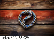 Textured Marine knot on wooden background. Generate AI. Стоковое AI-изображение, AI-художник Иван Рябоконь / Фотобанк Лори
