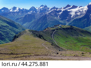 Panoramic mountain landscape with green highland valley, observatory in the distance and mountain peaks in the background. Стоковое фото, фотограф Евгений Харитонов / Фотобанк Лори