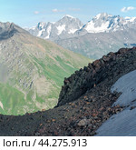 High mountain landscape with a herd of mountain ibex in the foreground. Стоковое фото, фотограф Евгений Харитонов / Фотобанк Лори