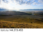 Wonderful sunrise landscape photo of morning Kurai steppe with chuya river, mountain ice peaks of Siberia and sunny sky of Altai background. Natural scenery of autumn mountain forest. Altai, Siberia. Стоковое фото, фотограф Евгений / Фотобанк Лори