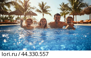 Family enjoying a sunny day by the pool, splashing water and laughing together in a tropical resort setting. Стоковое AI-изображение, AI-художник Сергей Толмачёв / Фотобанк Лори