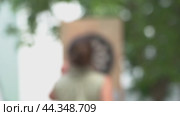 Playing darts outside. blurred video, a concept of a leisure team building game. Стоковая анимация, аниматор Скрипачев Антон / Фотобанк Лори