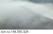 Time-lapse video of morning mist in the Altai mountains. Fog is floating over the slopes of mountain ridges. Стоковое видео, видеограф Сергей Пристяжнюк (Serg Zastavkin) / Фотобанк Лори
