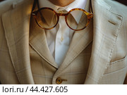 Man wearing glowing beige suit. Generate ai. Стоковое AI-изображение, AI-художник Иван Рябоконь / Фотобанк Лори