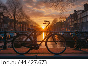 Bicycle amsterdam bridge sunset. Generate Ai. Стоковое AI-изображение, AI-художник Иван Рябоконь / Фотобанк Лори