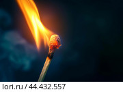 Ignited matchstick on a dark background. Стоковое AI-изображение, AI-художник Иван Рябоконь / Фотобанк Лори
