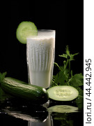 Glass of milk with fresh cucumber. Стоковое AI-изображение, AI-художник Veniamin Kraskov / Фотобанк Лори