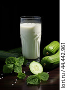 Glass of milk with fresh cucumber. Стоковое AI-изображение, AI-художник Veniamin Kraskov / Фотобанк Лори