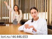 Unhappy female office employee after reprimand from angry chief. Стоковое фото, фотограф Яков Филимонов / Фотобанк Лори