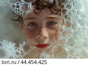 Child's face peering through sudsy bath bubbles. Стоковое AI-изображение, AI-художник Иван Рябоконь / Фотобанк Лори