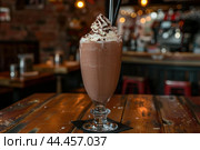 Decadent chocolate milkshake with whipped cream. Стоковое AI-изображение, AI-художник Иван Рябоконь / Фотобанк Лори