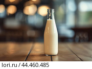 Fresh milk in a glass bottle on wooden table. Стоковое AI-изображение, AI-художник Иван Рябоконь / Фотобанк Лори
