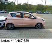 Changan BenBen E-Star is a 5-door city car hatchback. Pink small Changan Benni. Редакционное фото, фотограф Константин Григорьев / Фотобанк Лори